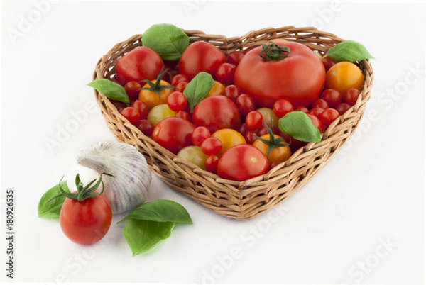 Fototapeta Tomatoes in a heartshaped basked