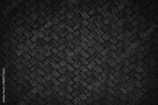 Fototapeta Old black bamboo weave texture background, pattern of woven rattan mat in vintage style.