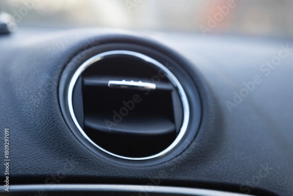 Fototapeta Close-up view of car air vent showcasing design and functionality from the interior perspective
