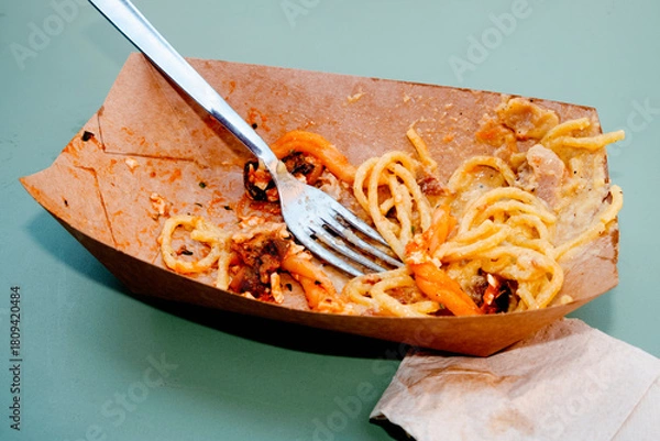 Obraz cardboard box with pasta leftovers on a table