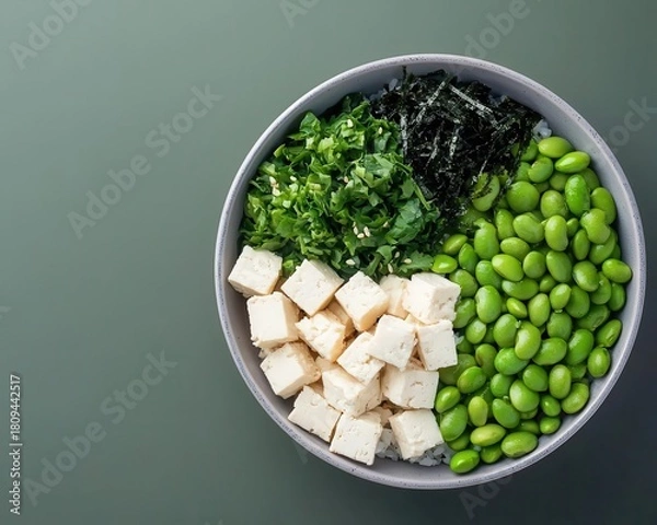 Fototapeta Vegan poke bowl with edamame, seaweed, and tofu cubes, plantbased eating, Hawaiianinspired dish