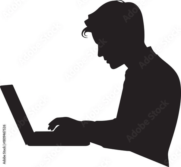 Fototapeta Silhouette of a young man working on a laptop computer