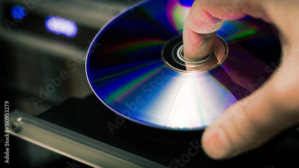 Fototapeta DVD disc inserting to player