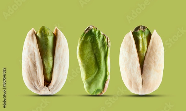 Obraz Pistachio nuts in closeup on pistachio background