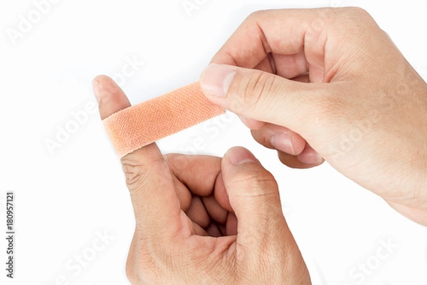 Fototapeta Bandage on the index finger isolate background