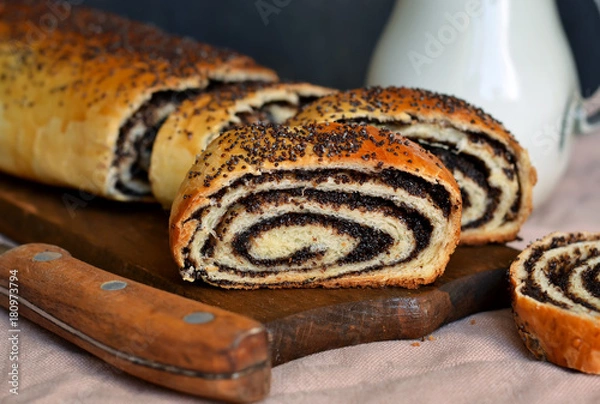Fototapeta Homemade roll with poppy seeds and milk for breakfast
