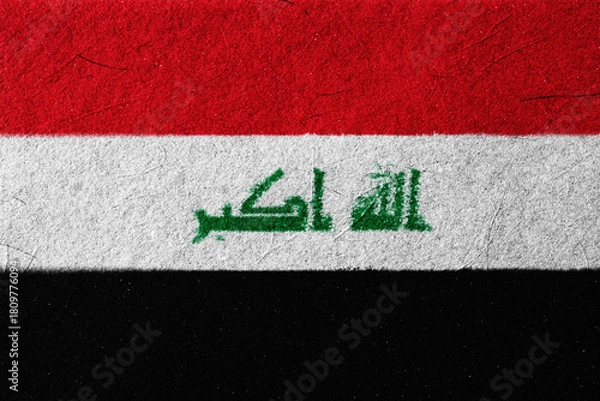 Fototapeta A textured rendition showcases the flag of Iraq, with its vibrant red, white, and black bands, and the green Arabic script symbolizing national identity and cultural heritage,