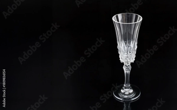 Obraz Elegant Crystal Champagne Flute on Black Background with Reflections