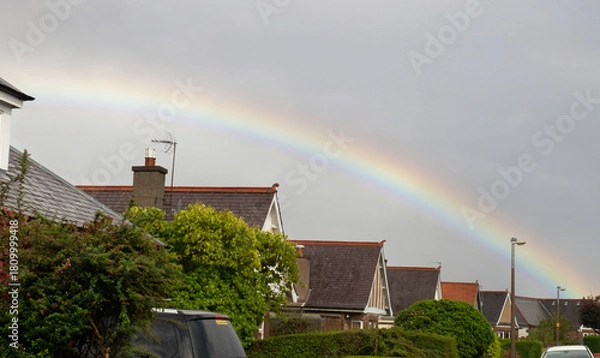 Obraz Rainbow adds colour to a drab housing estate in Morningside, Edinburgh, Scotland