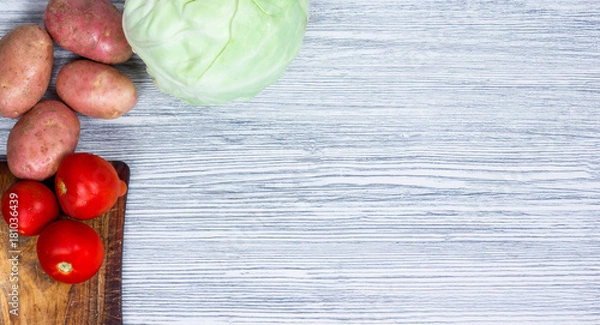 Fototapeta Vegetables on an old wooden table, ingredients, top view, copy space