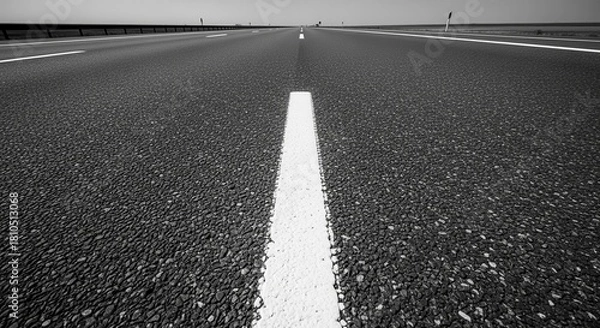 Obraz A Grayscale Perspective Of An Open Roadway Leading Into The Horizon Destination