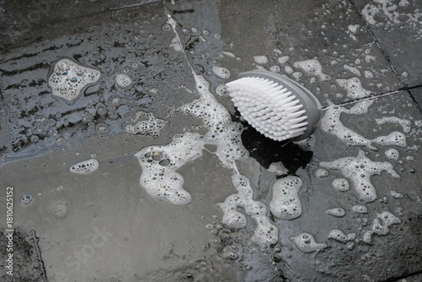Obraz laundry brush on a laundry foam