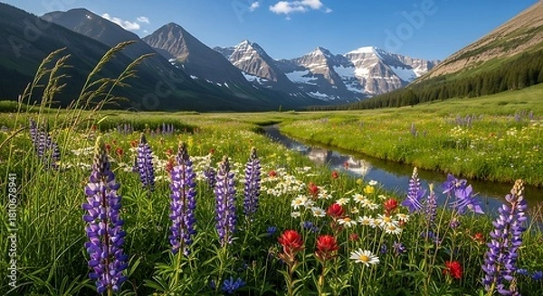 Fototapeta Stunning mountain valley landscape with a winding river and vibrant wildflowers in full bloom under a clear sky