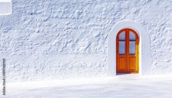 Fototapeta A vibrant orange arched double door stands out against a rough, textured white stucco wall, bathed in bright sunlight.