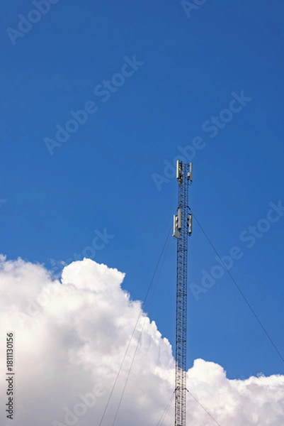 Obraz High mobile mast at a blue sky