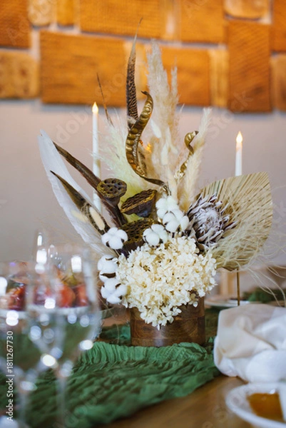 Fototapeta Unique floral arrangement on a dining table setting