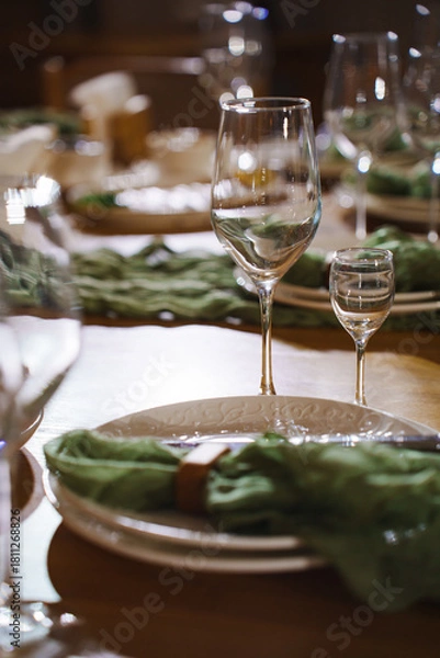 Fototapeta Elegant table setting for a dining event with glassware