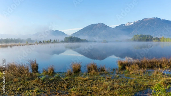 Fototapeta Epic landscape photo with morning fog in a moorland area in the mountains of the Bavarian Alps