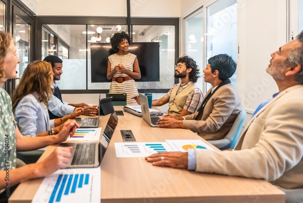 Fototapeta Diverse business team collaborating during a corporate meeting