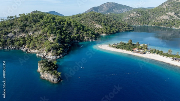 Fototapeta High-angle summer view of Ölüdeniz with its curved beach and crystal-clear waters.