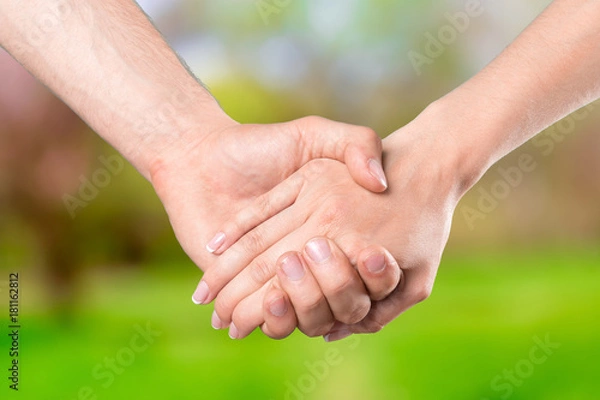 Fototapeta Shaking hands of two people