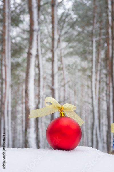 Obraz Christmas tree decorations in a winter forest.