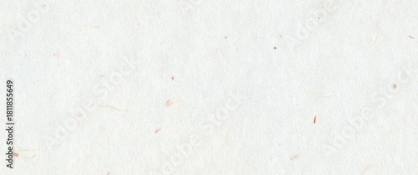 Fototapeta White handmade paper with subtle fiber textures and small colorful flecks. Organic and recycled mulberry paper background concept for craft art