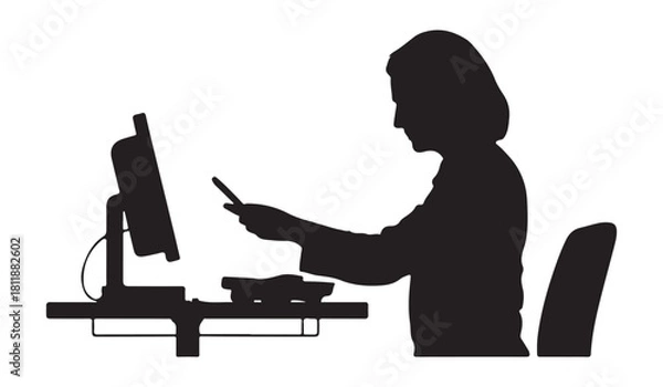 Obraz  Woman working on computer and holding a smartphone in office silhouette