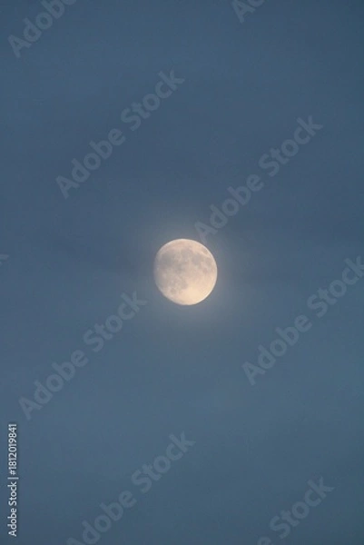 Obraz Full Moon Shines Through Ethereal Blue Clouds