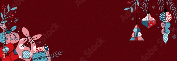 Obraz Festive patchwork Christmas background with eco-friendly fabric-wrapped gifts, hanging ornaments, winter foliage on a rich red backdrop, creating a cozy sustainable holiday design with copy space.