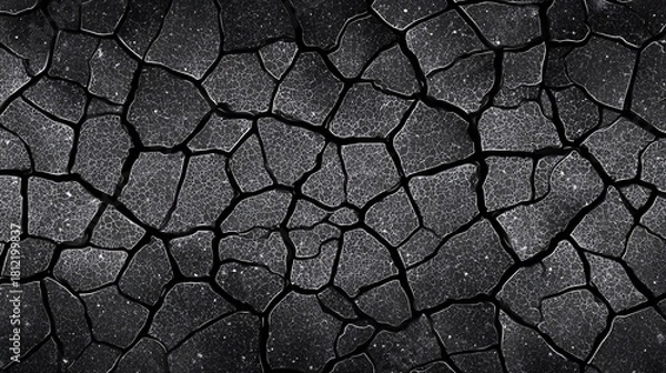 Fototapeta Close-up of cracked dry soil texture under natural lighting