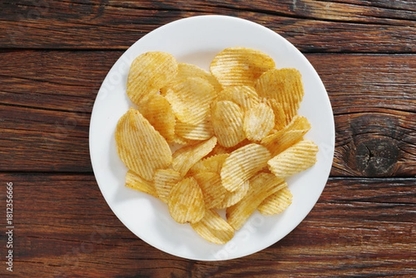 Fototapeta Potato chips on a plate