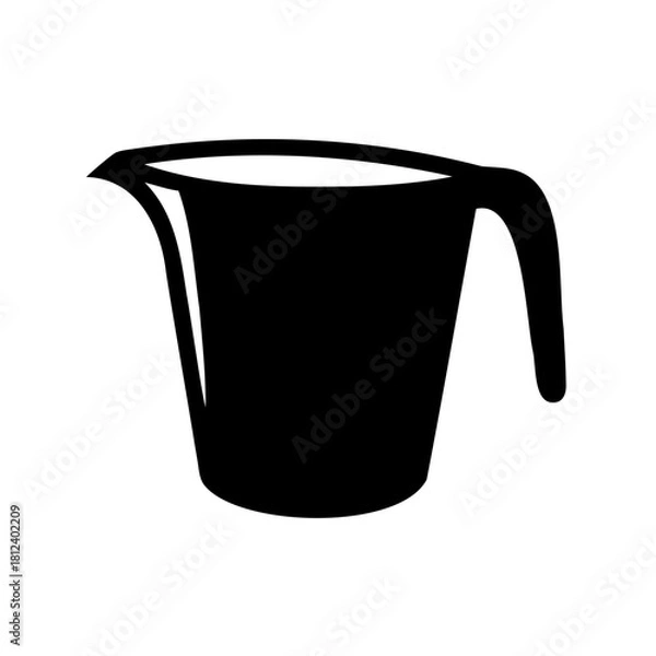 Fototapeta Silhouette of a black measuring cup with a handle and spout