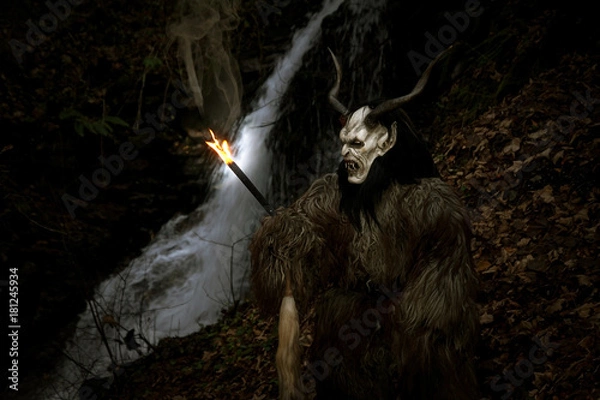 Obraz Satan with torch at the waterfall
