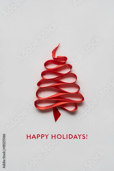 Fototapeta Magic tree / Creative concept photo of christmas tree made of ribbon on white background.