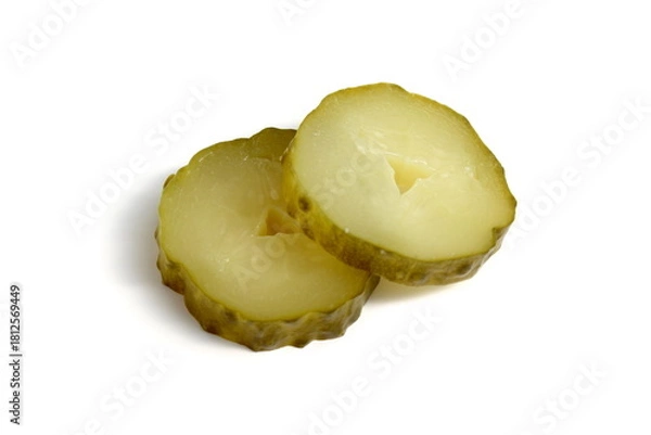 Fototapeta Sliced ​​pickled cucumbers lie on a white background.	