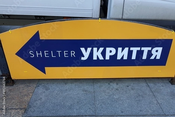 Fototapeta Pointer in Ukrainian language - bomb shelter in Kyiv. Protection from nuclear atomic war, shelling, explosion, shells for civilians.