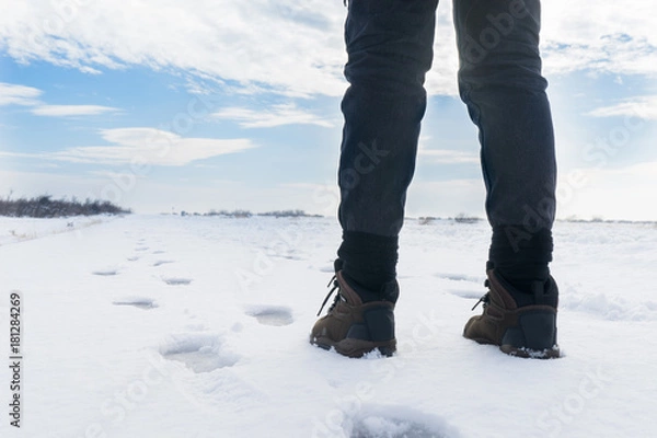 Obraz Woman is walking on the snow