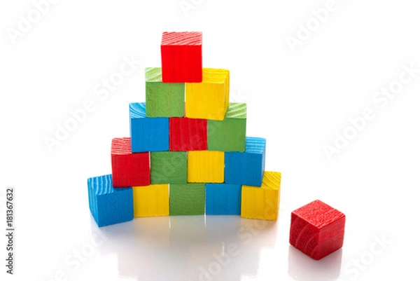 Fototapeta colorful wooden toy blocks stack up on a white background
