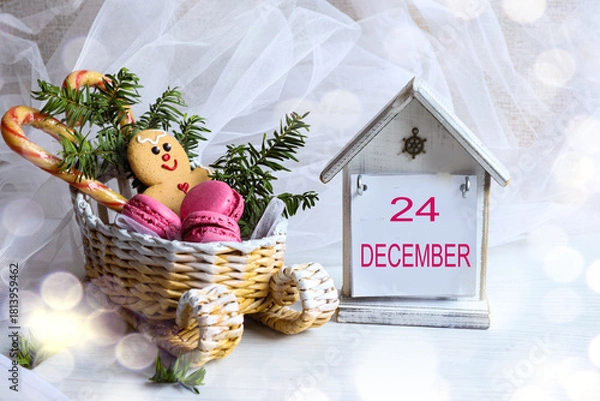 Fototapeta December 24 calendar: the number 24 and the month name "December" in English on a decorative calendar next to a sleigh