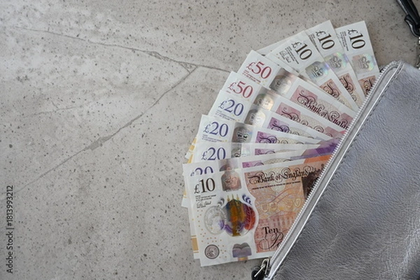 Obraz Silver partmone with british pound money. United Kindom bills in leather wallet for commerce concept.