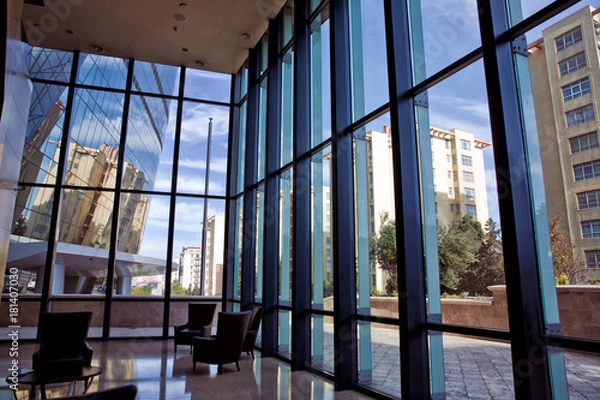 Fototapeta Building glass . window view of the building . Empty office room on modern building with sunlight