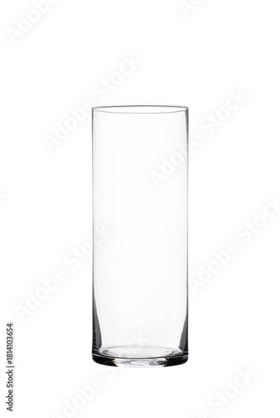 Fototapeta Transparent tall cylindrical glass vase isolated on white background for interior decor, floristry, and modern minimalist design concepts.
