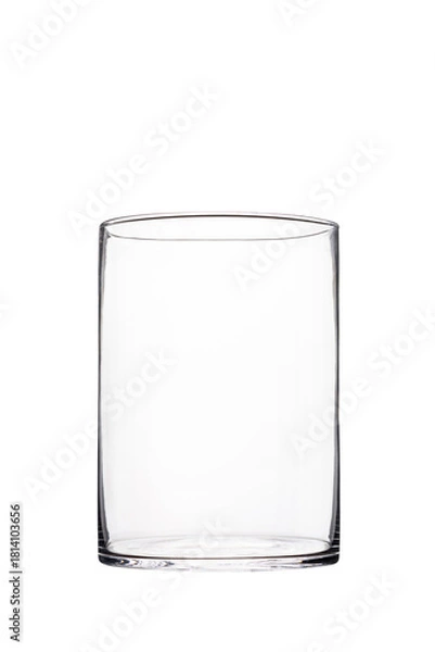 Fototapeta Transparent tall cylindrical glass vase isolated on white background for interior decor, floristry, and modern minimalist design concepts.