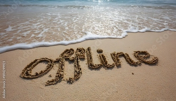 Obraz The word “offline” written in sand near the shoreline symbolizes taking a break from technology, embracing mindfulness, relaxation, and reconnecting with nature as waves gently wash the beach.