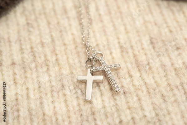 Obraz The cross-shaped necklace is a perfectly designed accessory.