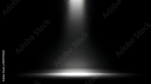 Obraz Spotlight illuminating a dark stage with a bright beam of light image