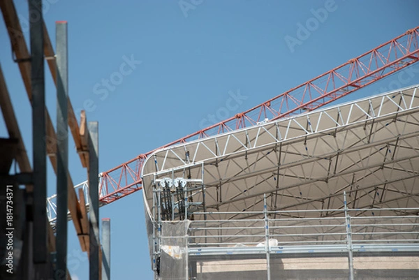 Fototapeta Scaffolding on the roof of a construction site to protect workers from the sun's rays and heat, Rome, Italy.