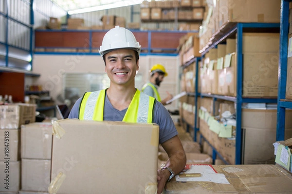 Fototapeta Warehouse worker checking stock products for prepare to packing to customer.
