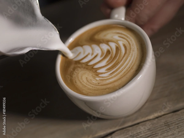 Obraz Cappucino in coffe cup with a can